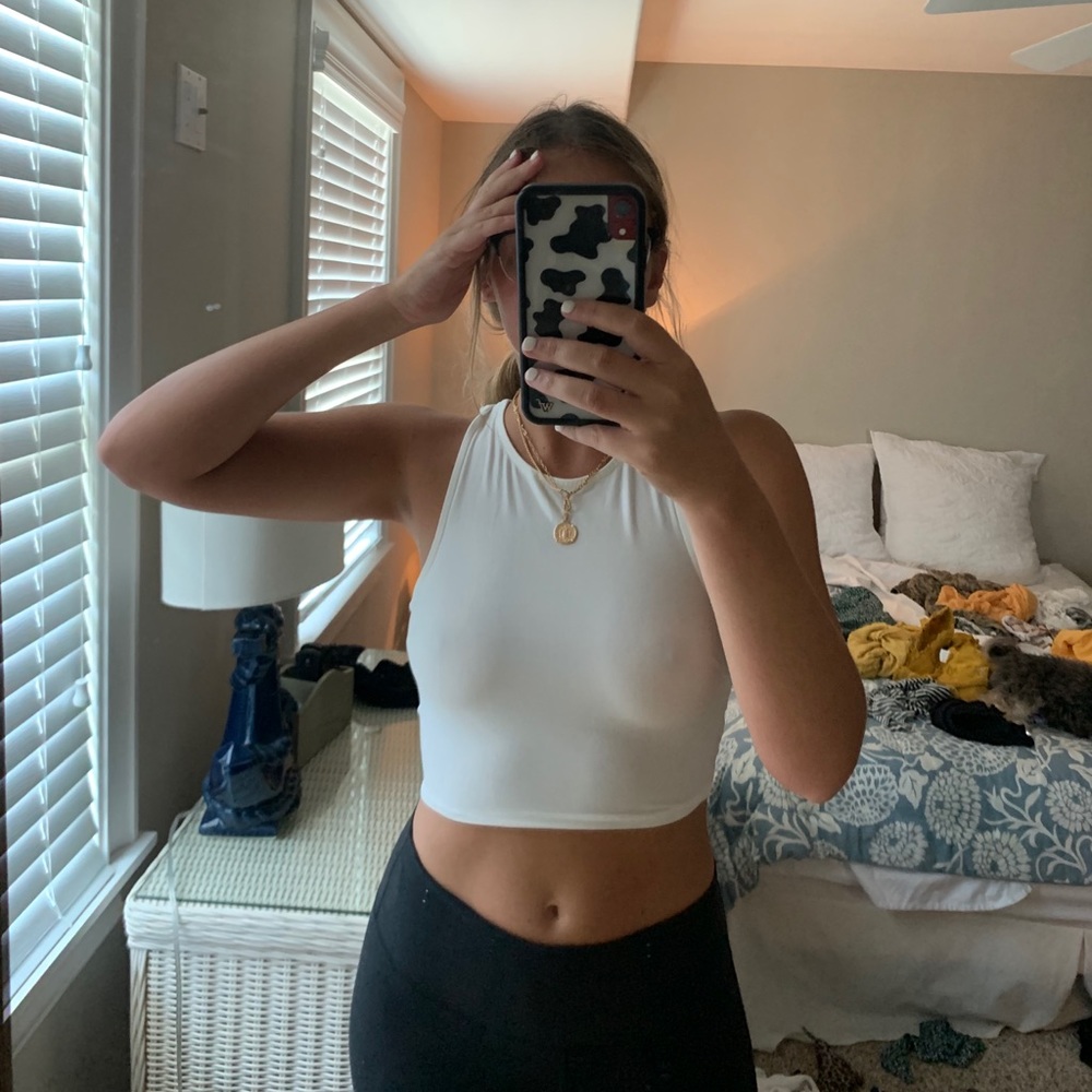 Open back, white. Tight, cropped top